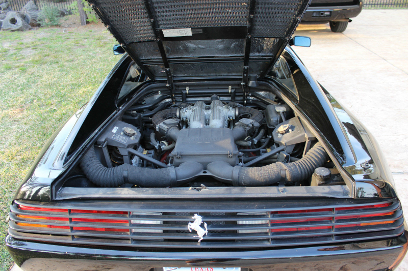 Illustration for article titled Holy Hell, This Gorgeous Black Ferrari Is The Price Of A Used Mustang